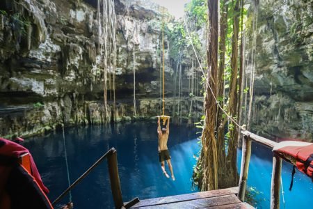 Rope swing at Cenote San Lorenzo Oxman